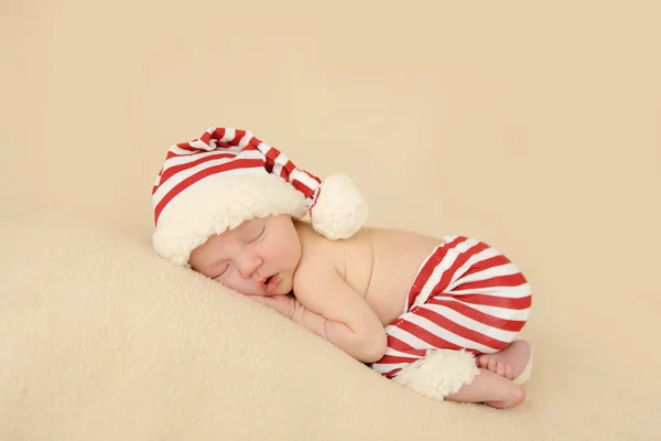 Newborn baby sleeping with santa hat christmas