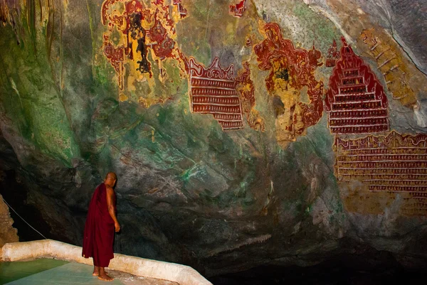 Amazing view religious carving on limestone rock in sacred cave. Hpa-An, Myanmar. Burma.