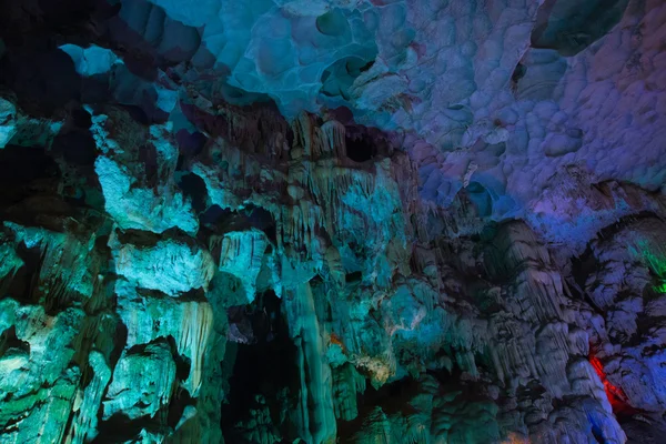 Mountain inside the cave with multicolored lighting in Vietnam.