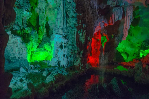 Mountain inside the cave with multicolored lighting in Vietnam.