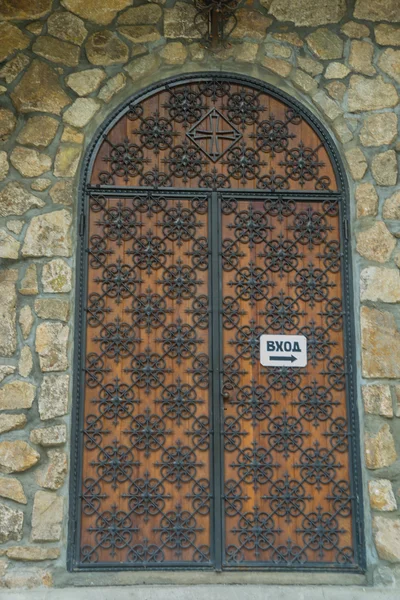 The monastery of stone, The stone entrance of the temple, the door pattern.Caucasus.Russia.