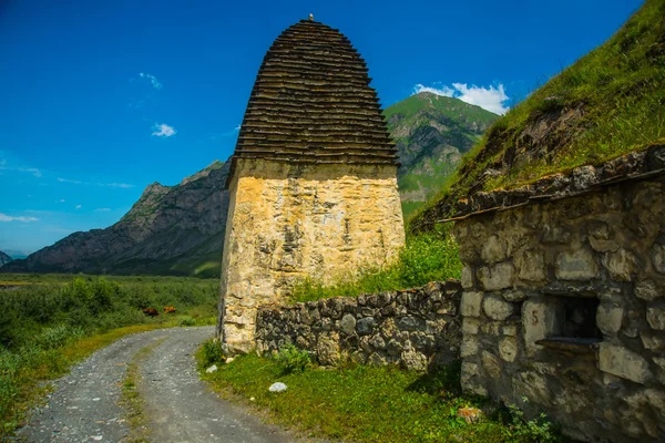City of the dead.Stone tombs on the hill. Road.The Caucasus.Russia.