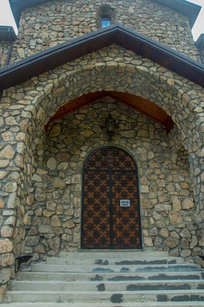 The monastery of stone, The stone entrance of the temple, the door pattern.Caucasus.Russia.