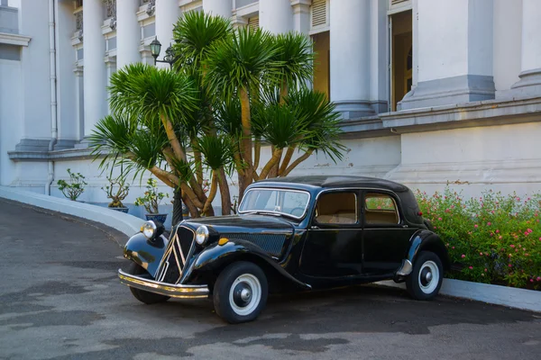 HO CHI MINH CITY, VIETNAM. Gia Long Palace, a Saigon\'s French colonial architecture, near Ben Thanh Market, now are history museum.Saigon.The car is old.