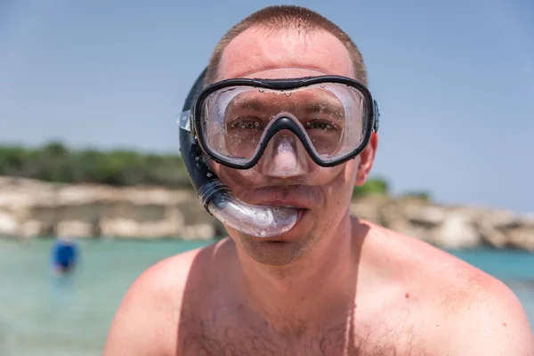 Man with diving mask at the sea