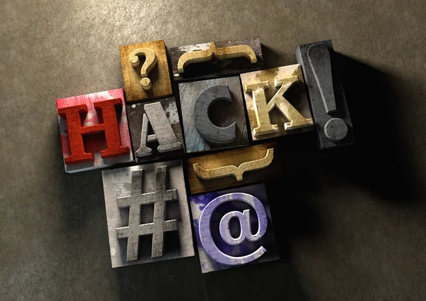 The word hack made from colorful grunge textured wooden printing