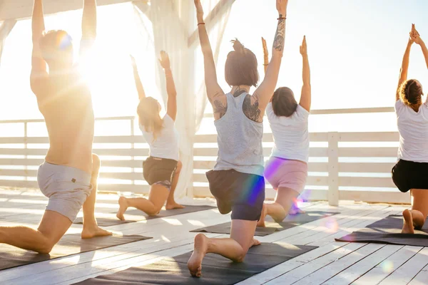 Group of people practicing yoga