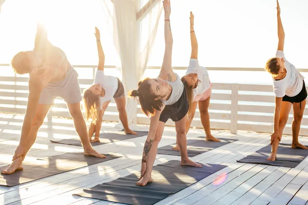 Group of people practicing yoga