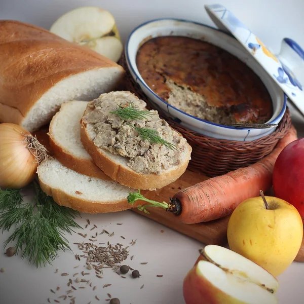 Apples, carrot and slices of bread with hepatic pate