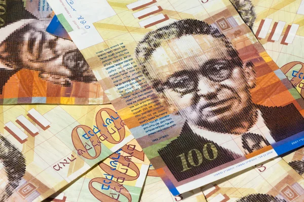 Stack of Israeli money bills of 100 shekel - top view