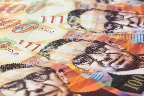 Stack of Israeli money bills of 100 shekel
