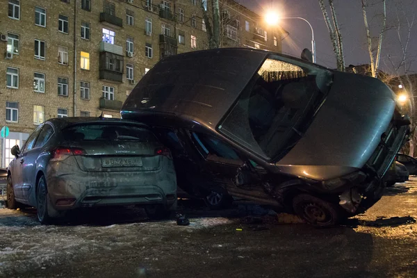 Car parked on roof of the other two