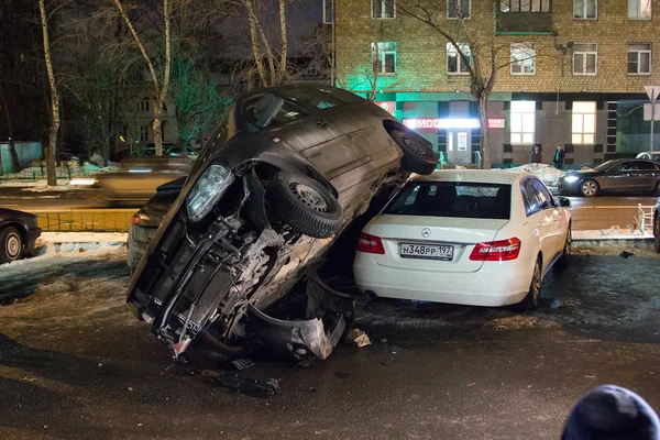 Car parked on roof of the other two