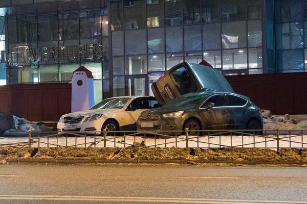 Car parked on roof of the other two