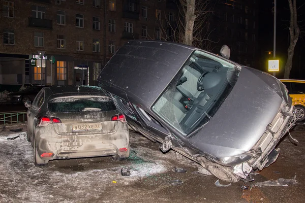 Car parked on roof of the other two