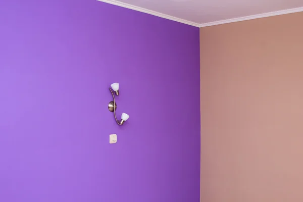 Wall painted in bright color and wall lights