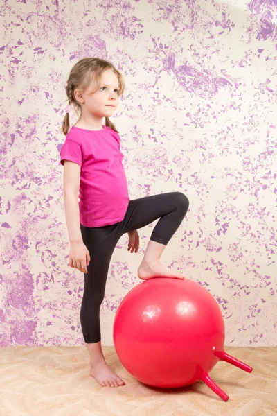 Cute little girl with gymnastic ball
