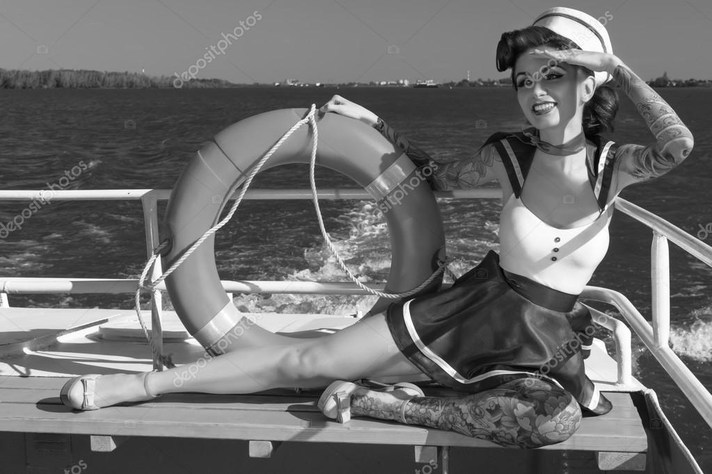 http://st2.depositphotos.com/4662363/7385/i/950/depositphotos_73854131-Pin-up-girl-sailor-on-the-ship.jpg