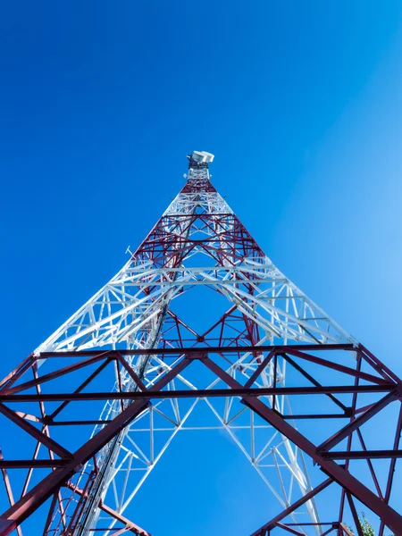 Communication tower over a blue sky III