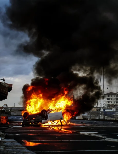 A vehicle overturned in flames