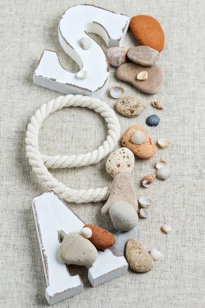 Concept of the summer time with sea shells and stones. Decorativ