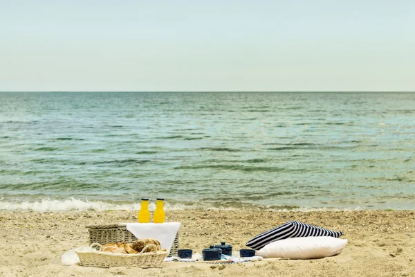 Summer picnic on the beach. Serving picnic utensils blue with ve