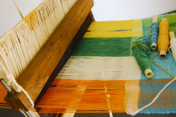 Vintage manual weaving loom with unfinished textile work