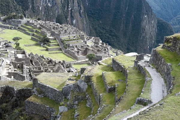 View of the ancient Inca City of Machu Picchu. The 15-th century Inca site.\'Lost city of the Incas\'. Ruins of the Machu Picchu sanctuary. UNESCO World Heritage site