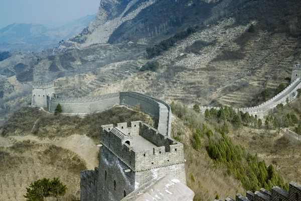 The Great Wall of China over mountains in Beijing, China.