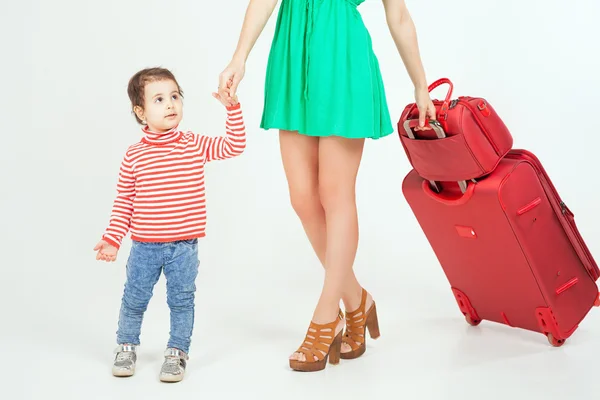 Child with mother ready to travel to Europe, Italy