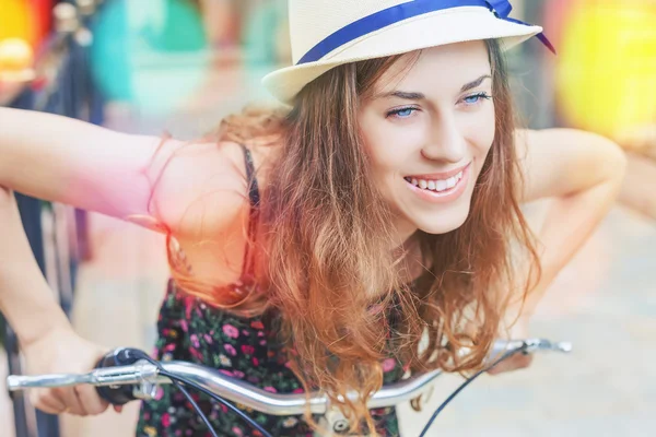 Closeup woman riding by vintage city bicycle at city center