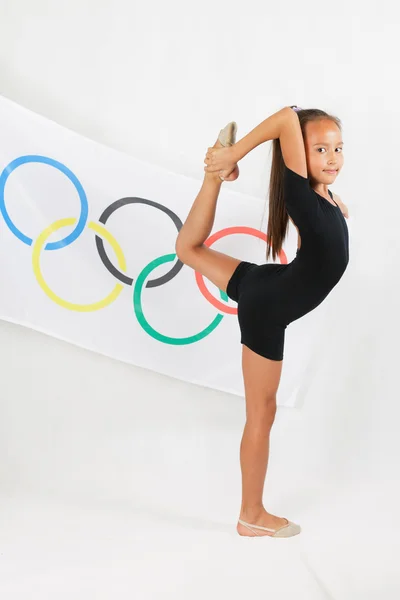 Child doing artistic gymnastics element