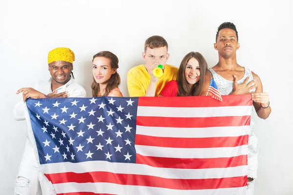 Group of multiracial people holding a american flag