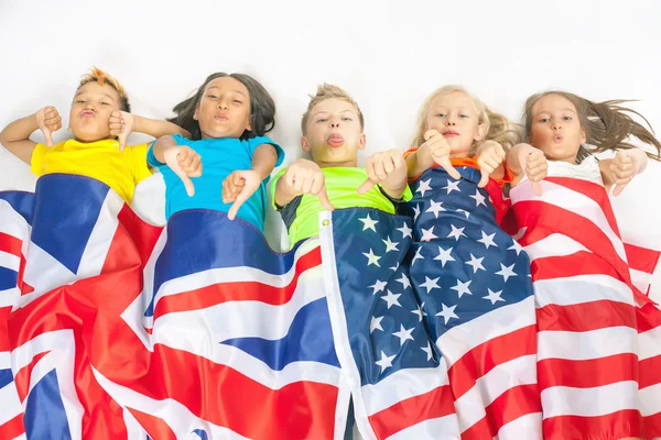 Kids holding flags Great Britain and american