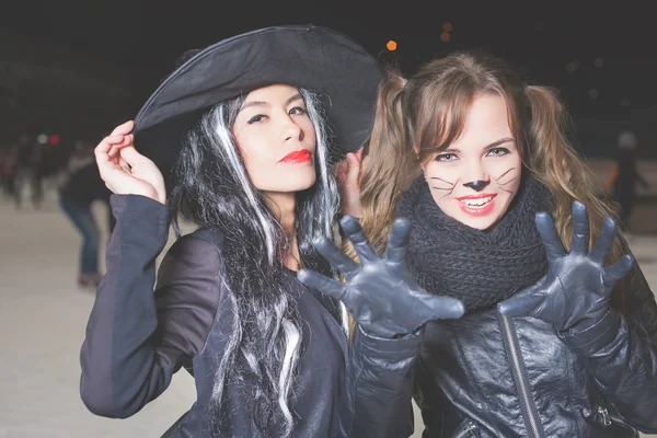 Halloween party! Young women like witch and cat role