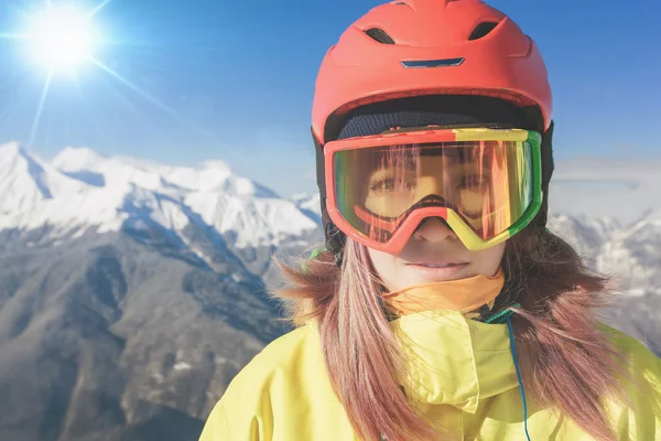 Snowboarder girl at Alps, Swiss mountain. Winter activities