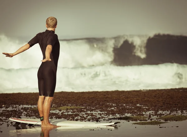 Man doing exercises at the beach