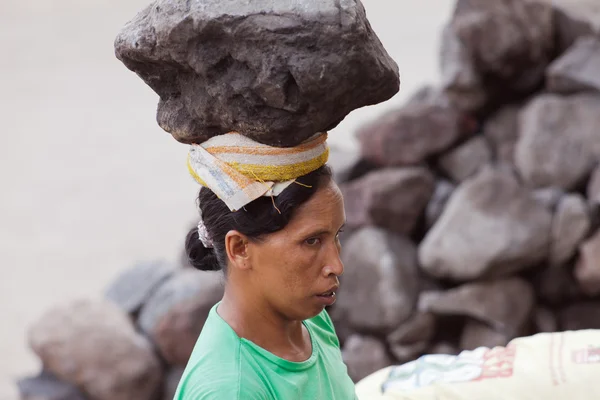 Hard work of woman in Bali