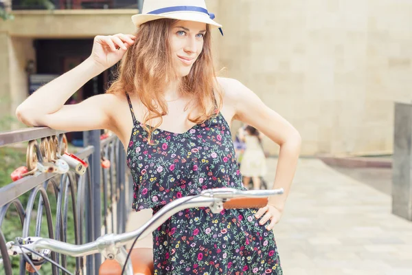 Fashion woman travel at europe by city vintage bicycle