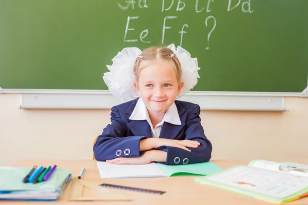 Desktop background of student sitting at desk for classwork