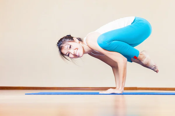 Happy asian woman doing exercise of yoga indoor at home