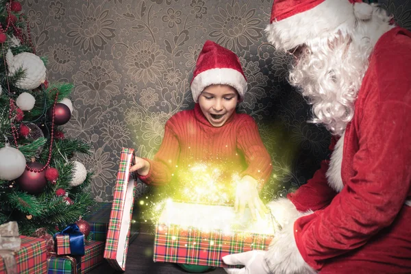 Christmas inspiration! Happy shocked boy surprised to see Santa