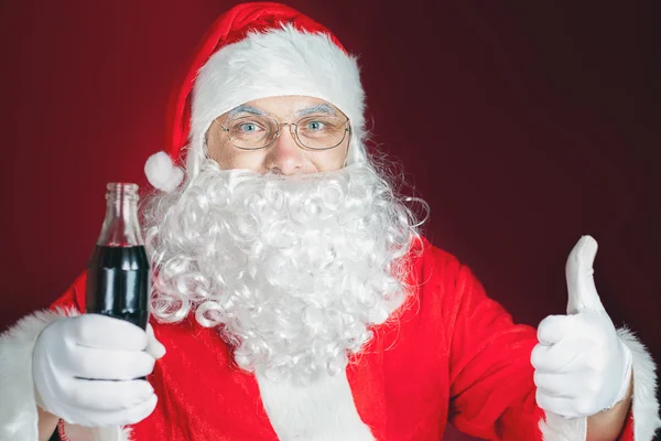 Santa Claus holding Coca Cola fresh beverage, Christmas holiday