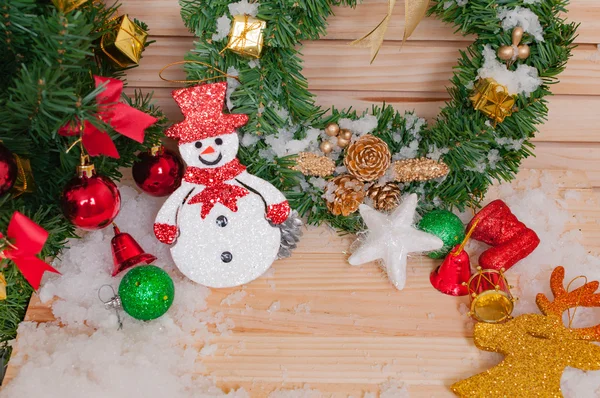 Snow and Christmas ornament for decoration on a wooden table