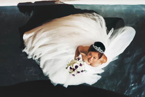 Asian happy bride in white dress