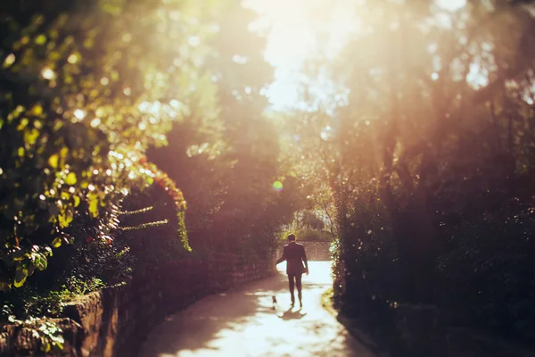 Groom walking with dog