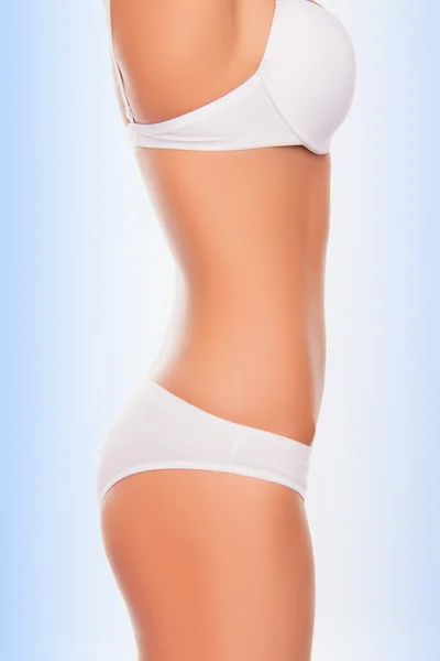 Side view photo of slim fit woman\'s body in white underwear