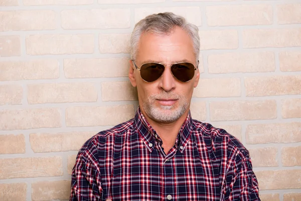 Portrait of handsome old man with sunglasses