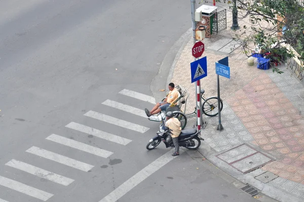 Nha Trang, Vietnam - February 5, 2016: Motorcycle and cycle taxi are waiting for guests on a pavement in Vietnam