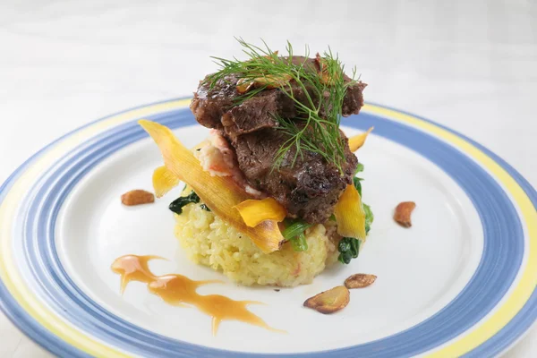 Turmeric rice junior beef short ribs with rice on plate